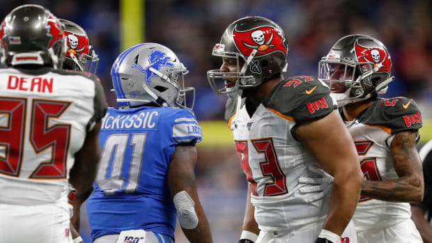 Tampa Bay Buccaneers nose tackle Ndamukong Suh (93) yells at Detroit Lions running back J.D. McKissic (41) during the second quarter at Ford Field.